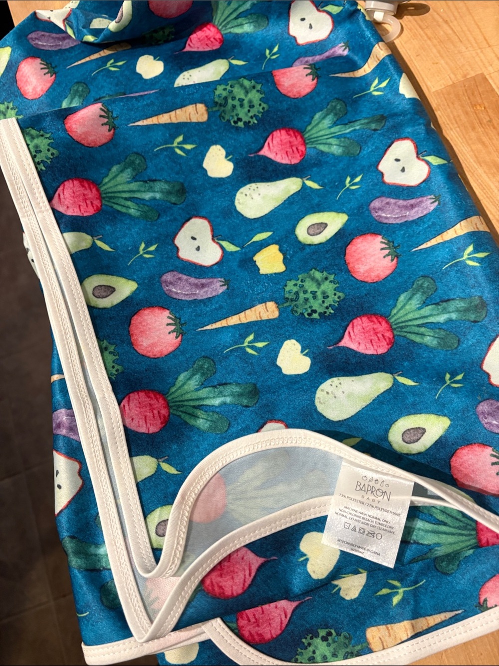 Bapron Baby splash mat with Produce Print - Teal Background